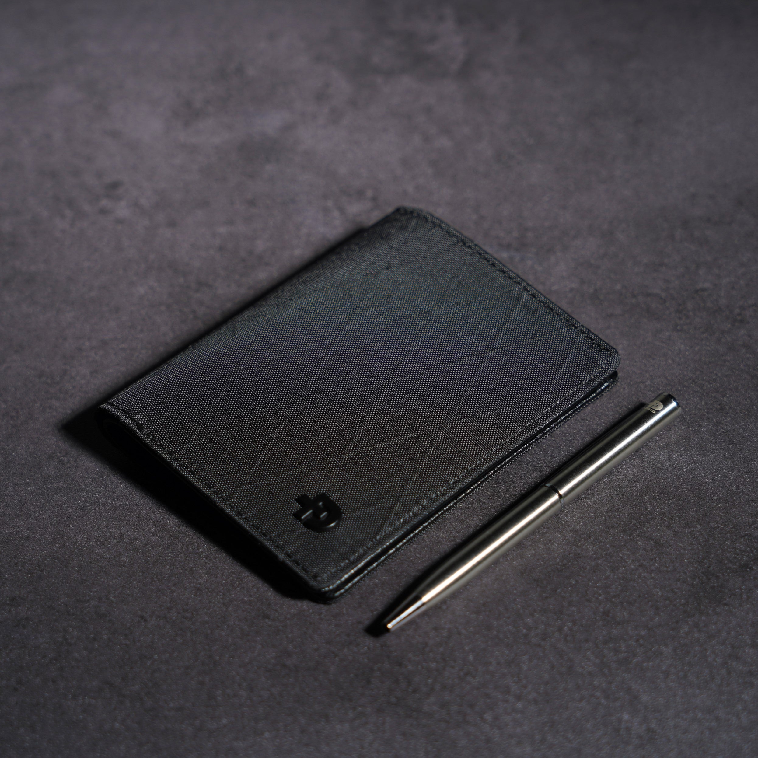 Close-up detail of weather-resistant X-Pac fabric and stitching on ADD1D Explorer Wallet S