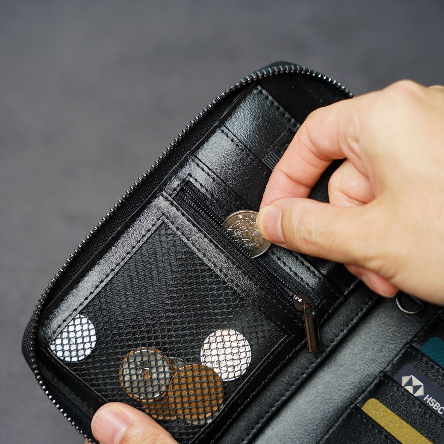 Zippered coin and tracker compartment inside ADD1D Explorer Wallet T