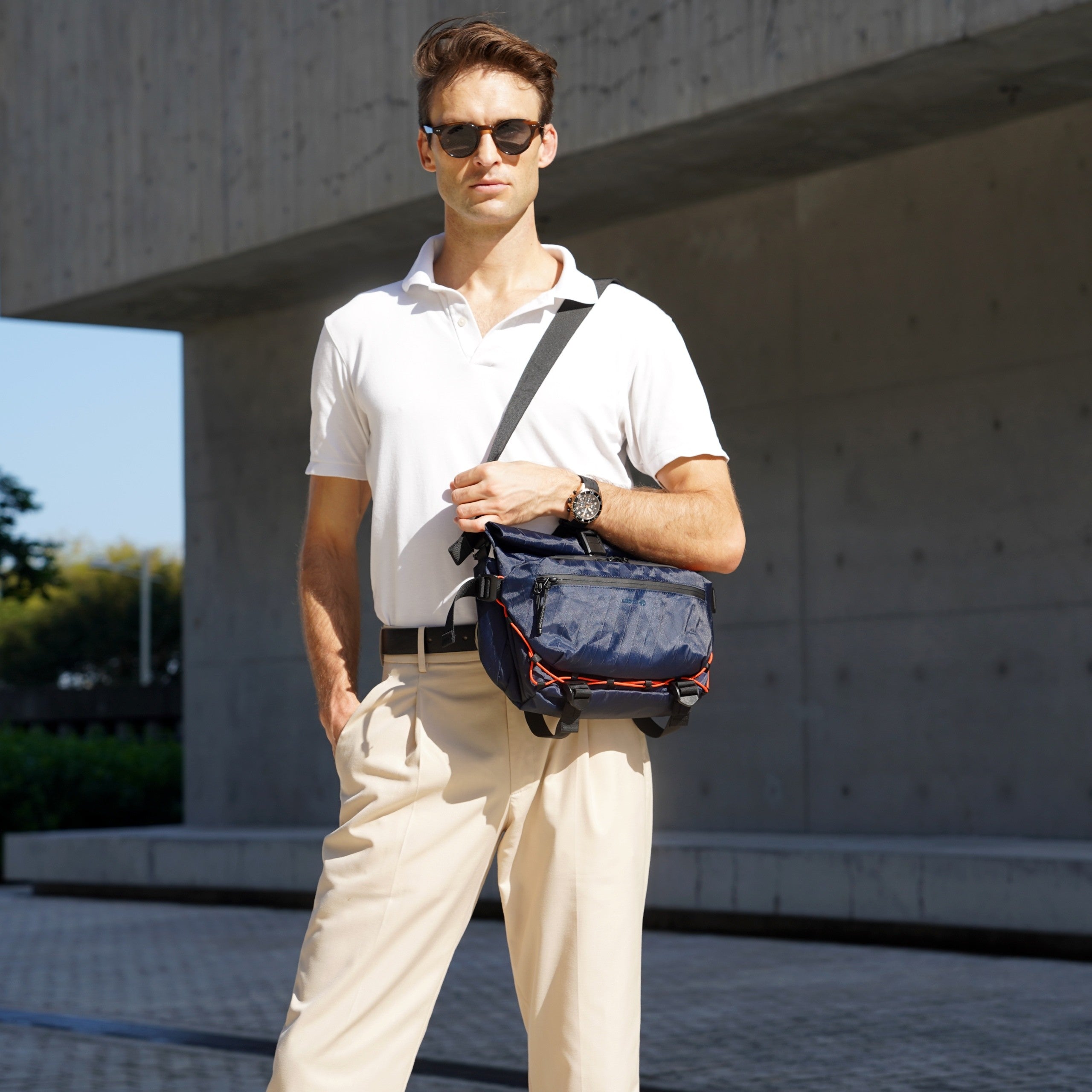 Model wearing the ADD1D Kangaroo Sling Elite as an urban everyday carry crossbody bag