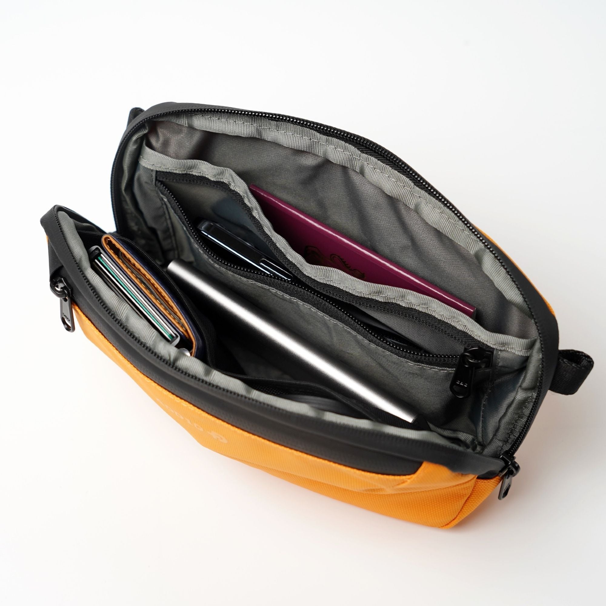 Open interior of ADD1D Baby Pouch showing mesh dividers