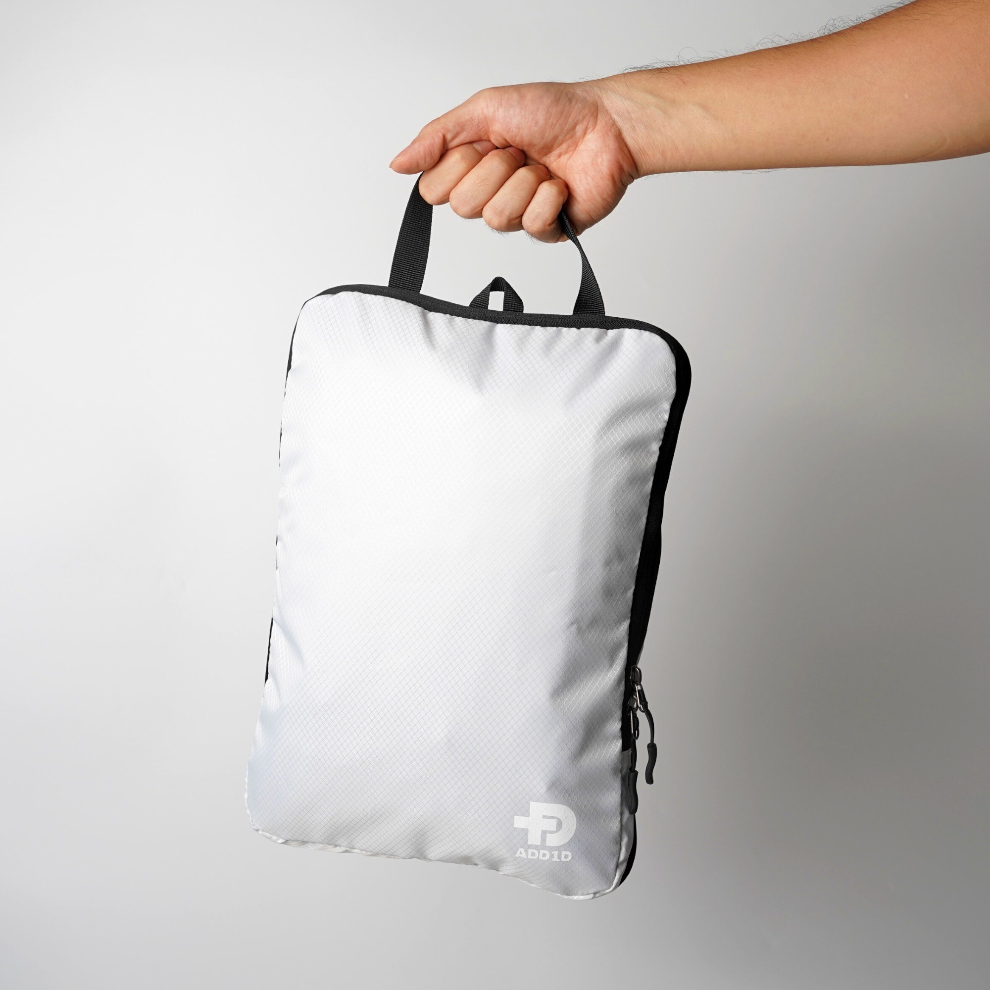 Top webbing grab handle and quick-identification label panel on ADD1D compression packing cube