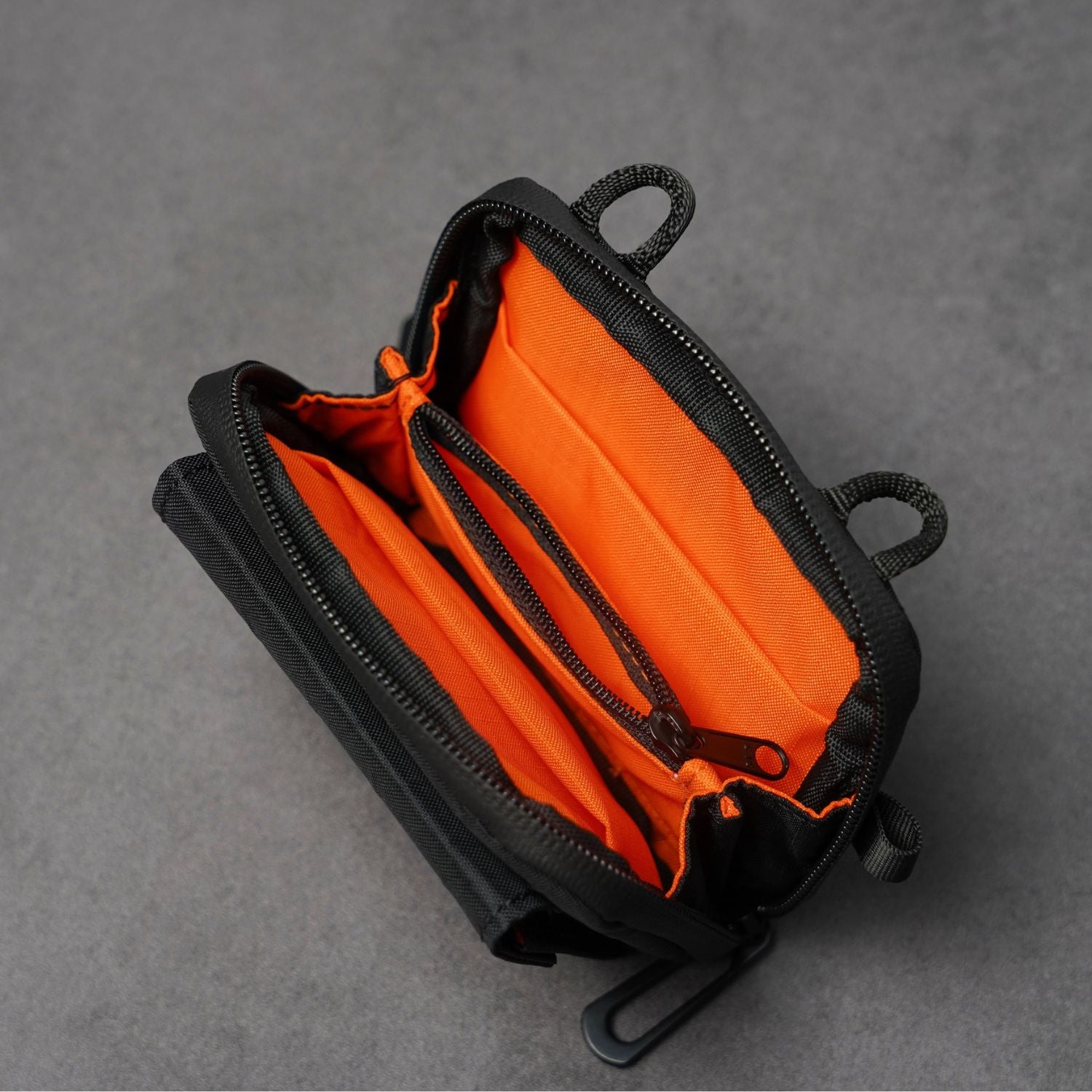 Open interior of ADD1D D2D Pouch Nano showing high-visibility orange lining