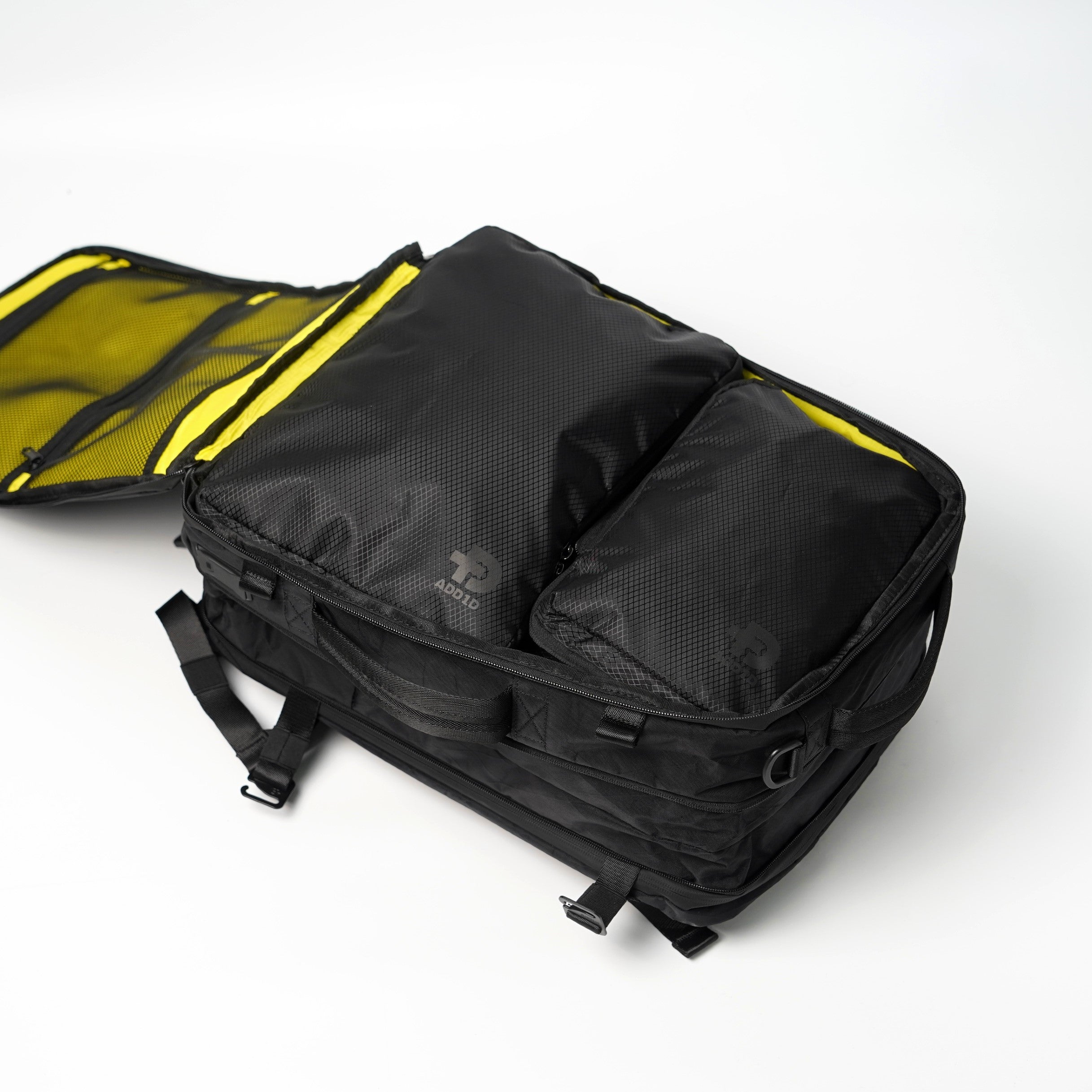 Open clamshell main compartment of ADD1D Explorer Pack featuring high-visibility yellow lining