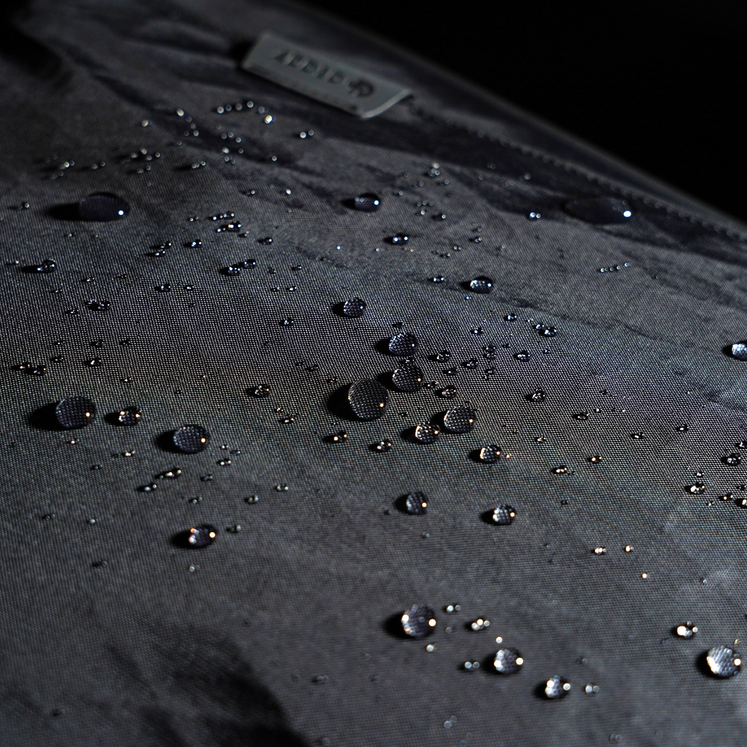 Close-up of durable VX42 X-Pac fabric and YKK AquaGuard waterproof zippers on ADD1D Explorer Pack