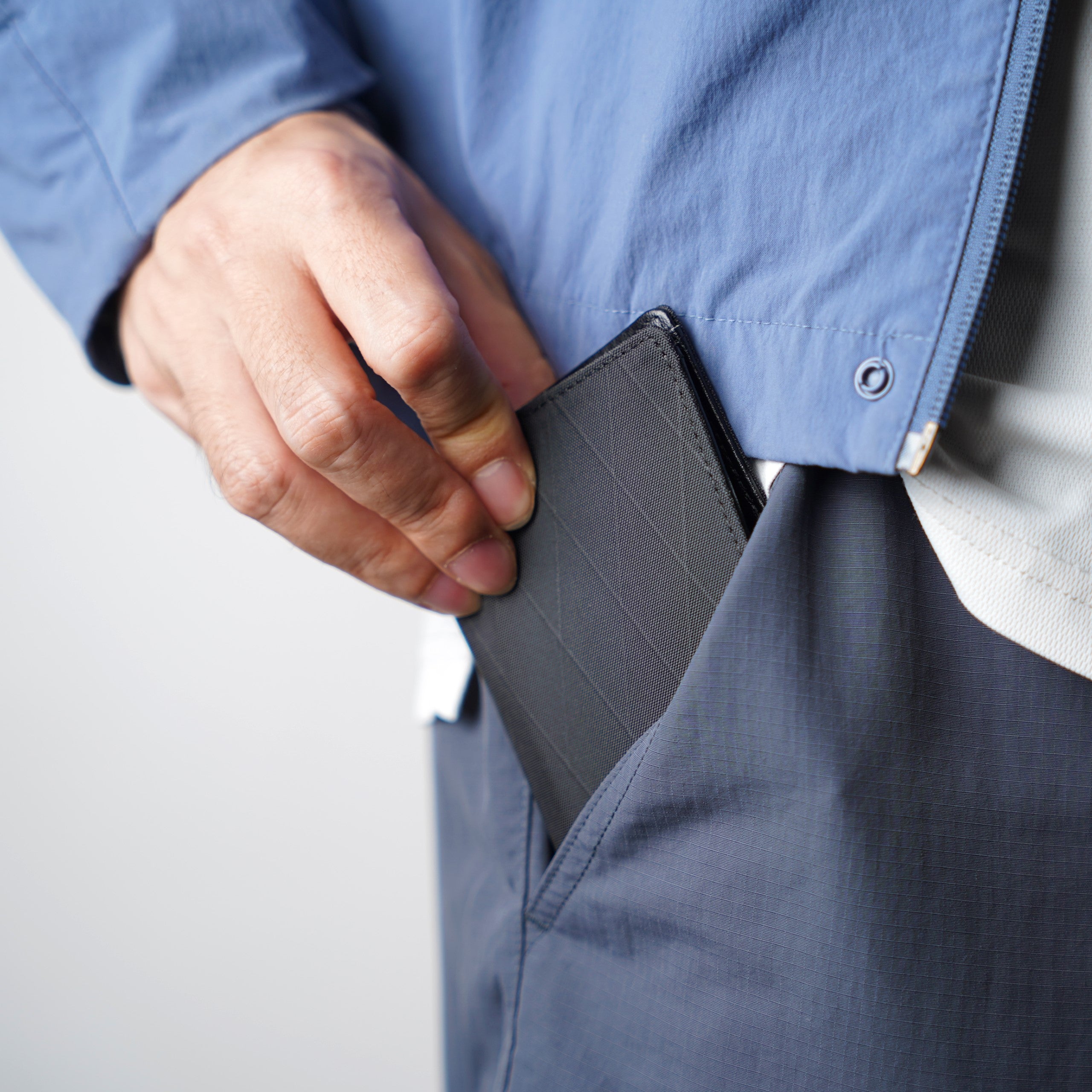 Side profile view showing the ultra-slim front pocket fit of the ADD1D Explorer Wallet S