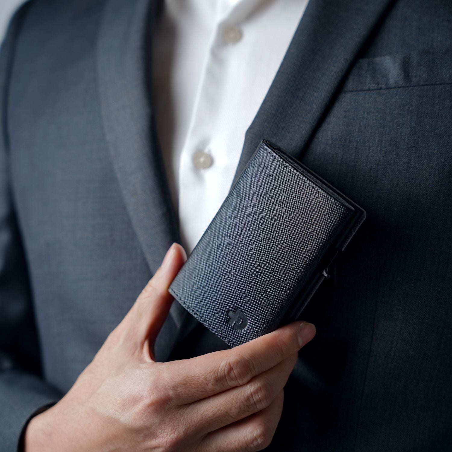 Close-up of premium scratch-resistant Saffiano leather texture and zipper on ADD1D Explorer Wallet