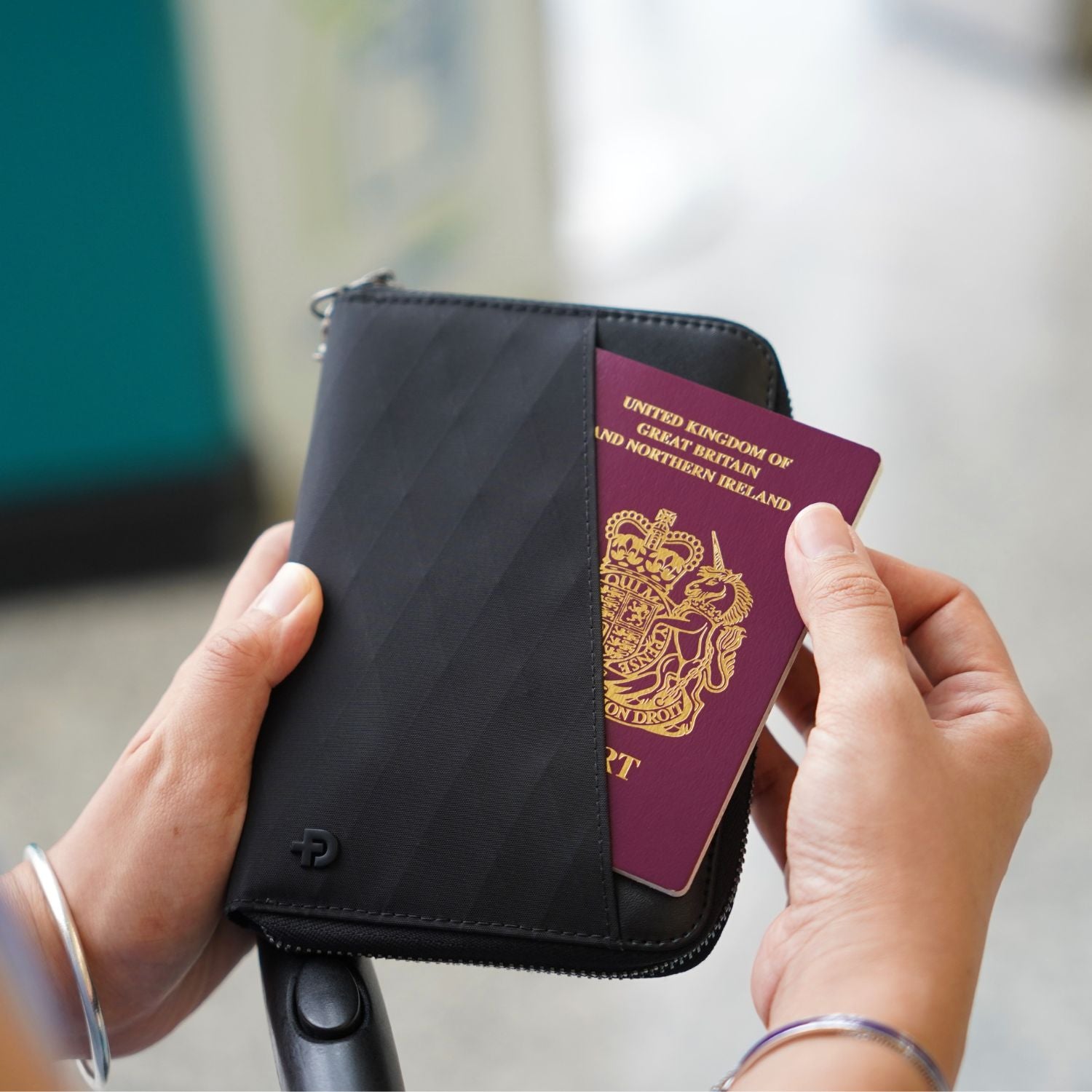 External quick-access pocket on ADD1D Explorer Wallet T holding boarding pass and passport for airport check-in