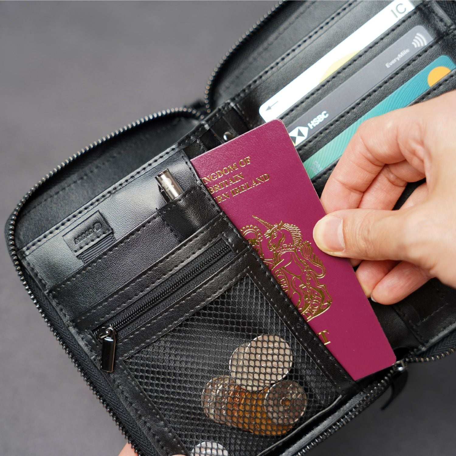Open interior of ADD1D Explorer Wallet T showing multiple passport pockets, ticket slots, and cash organization