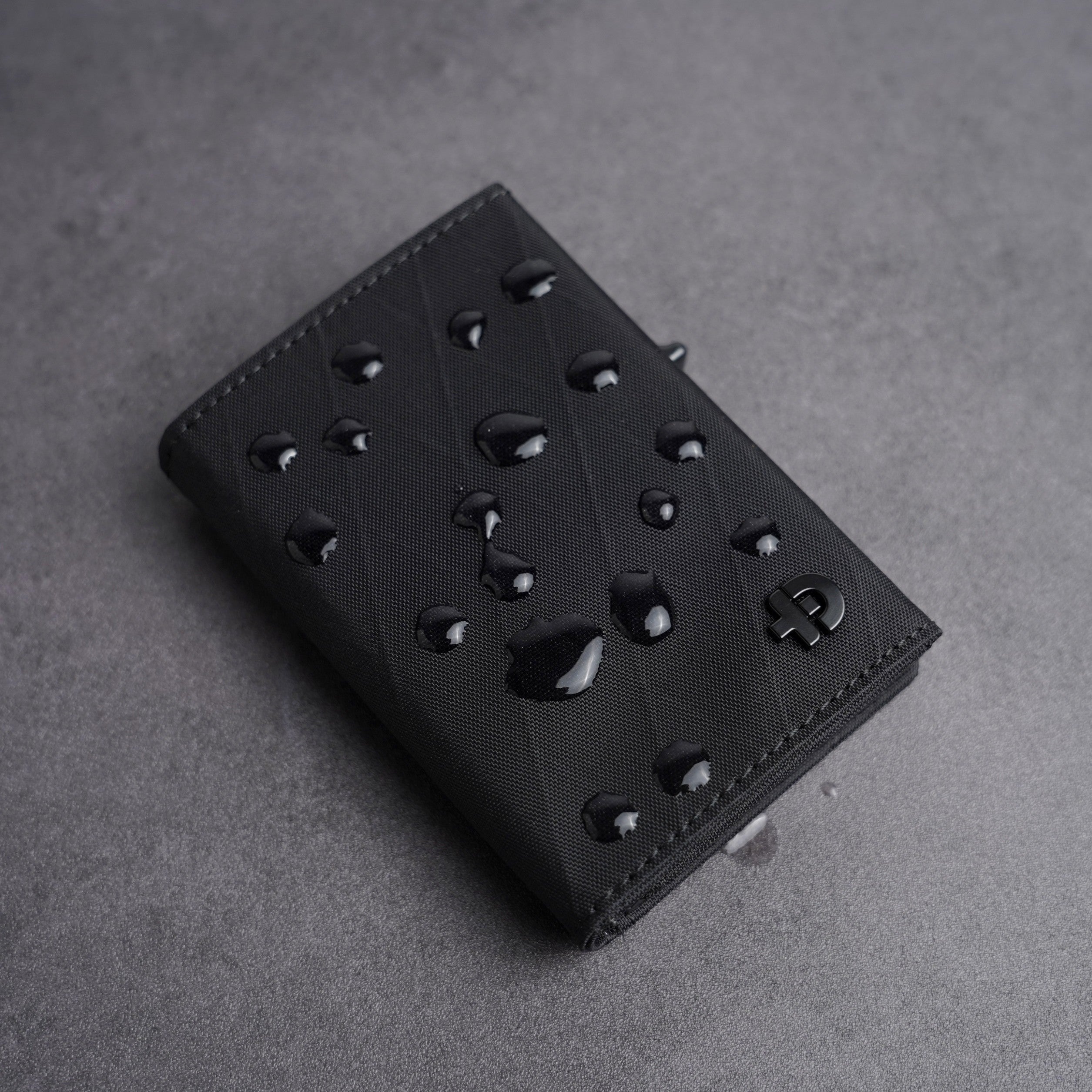Close-up detail of weather-resistant X-Pac fabric on ADD1D Explorer Wallet