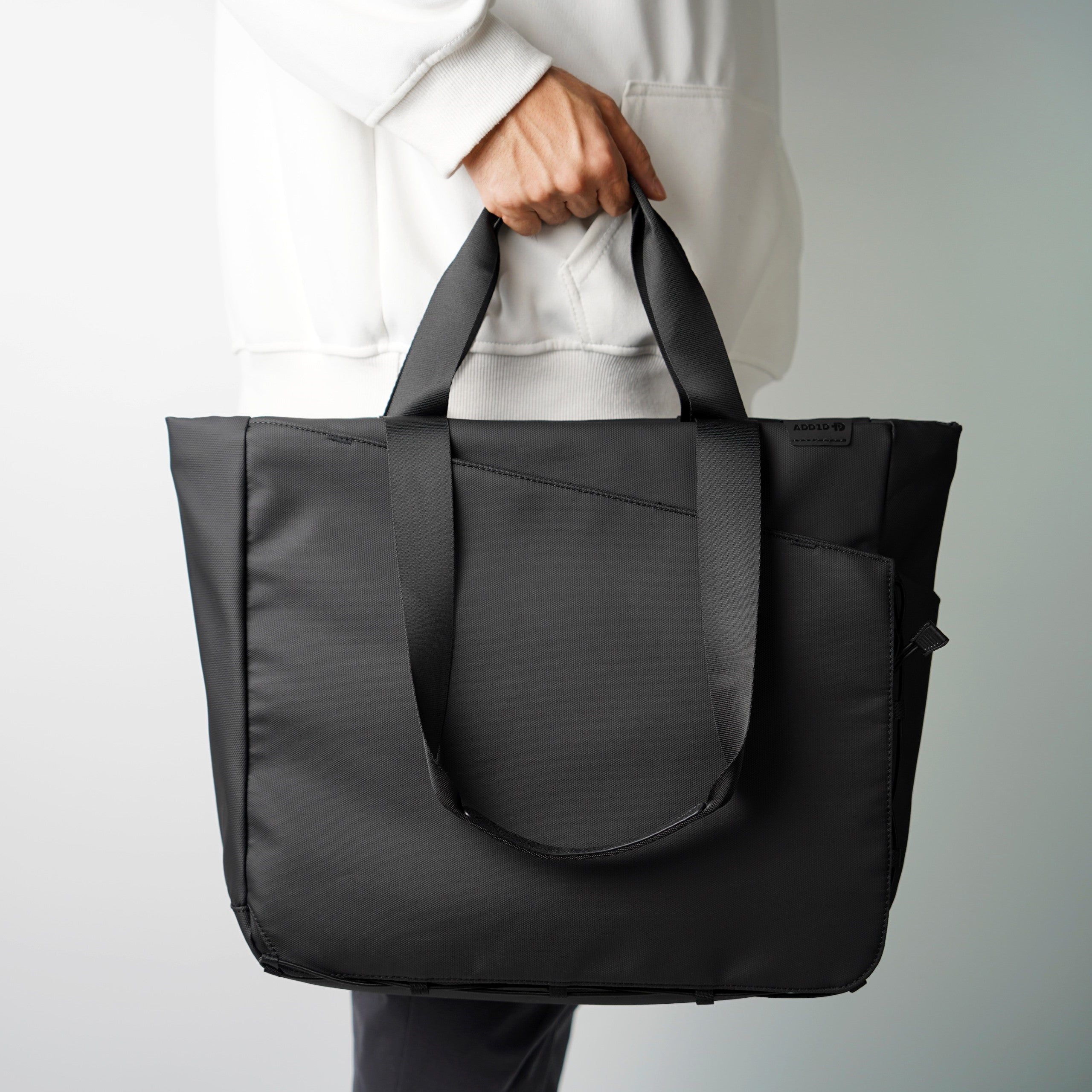 ADD1D Kangaroo Messenger Tote showing convertible shoulder strap and tote handle modes