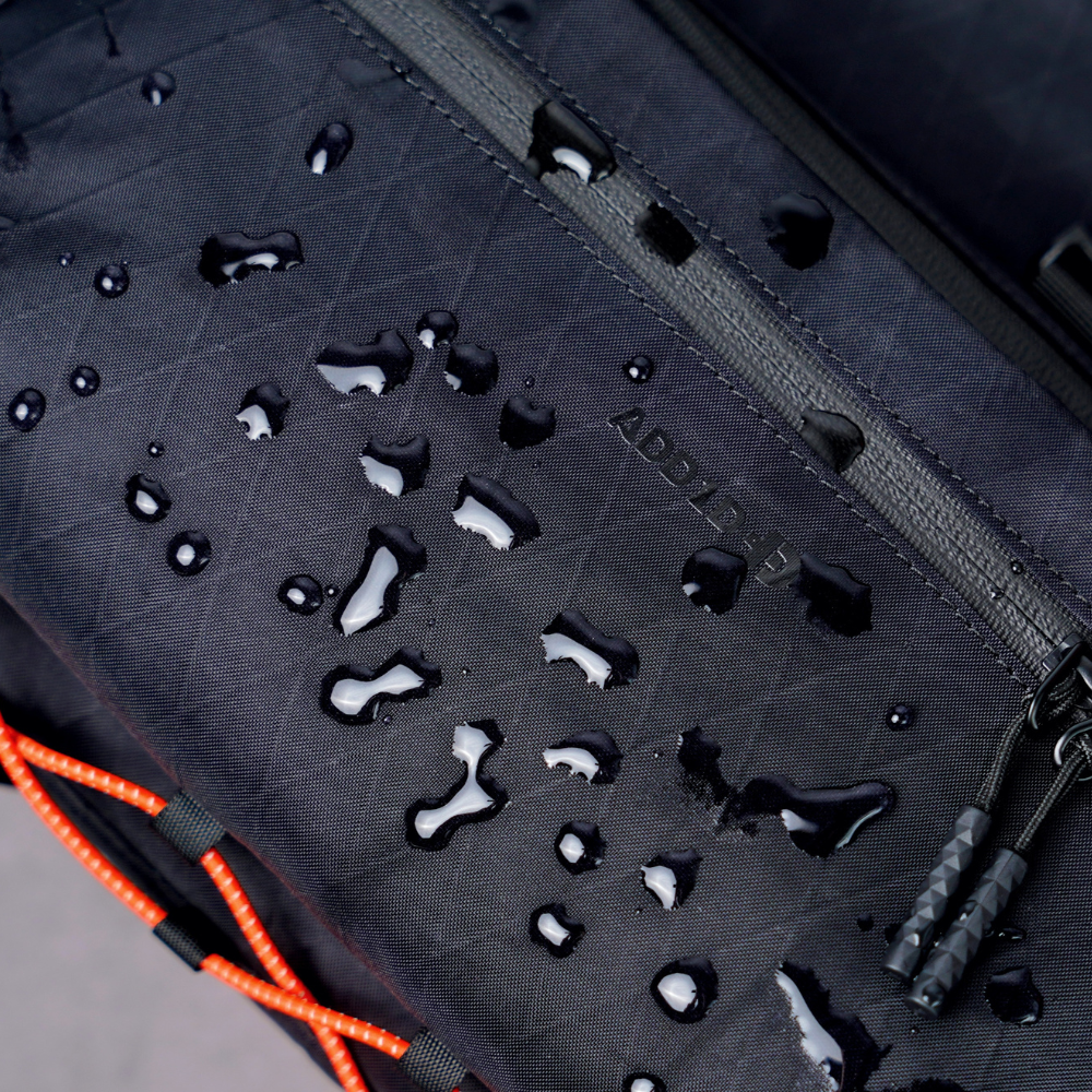 Detail shot of weather-resistant X-Pac fabric and YKK AquaGuard zipper on Kangaroo Sling Elite