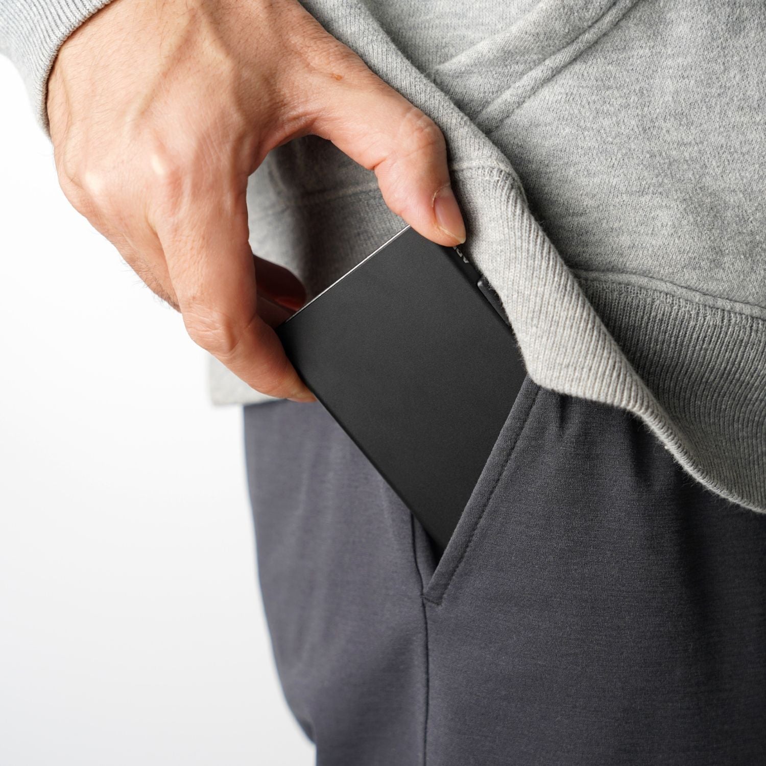 Close-up detail of RFID-blocking anodized aluminum core and outer shell on ADD1D Pop-Up Cardholder