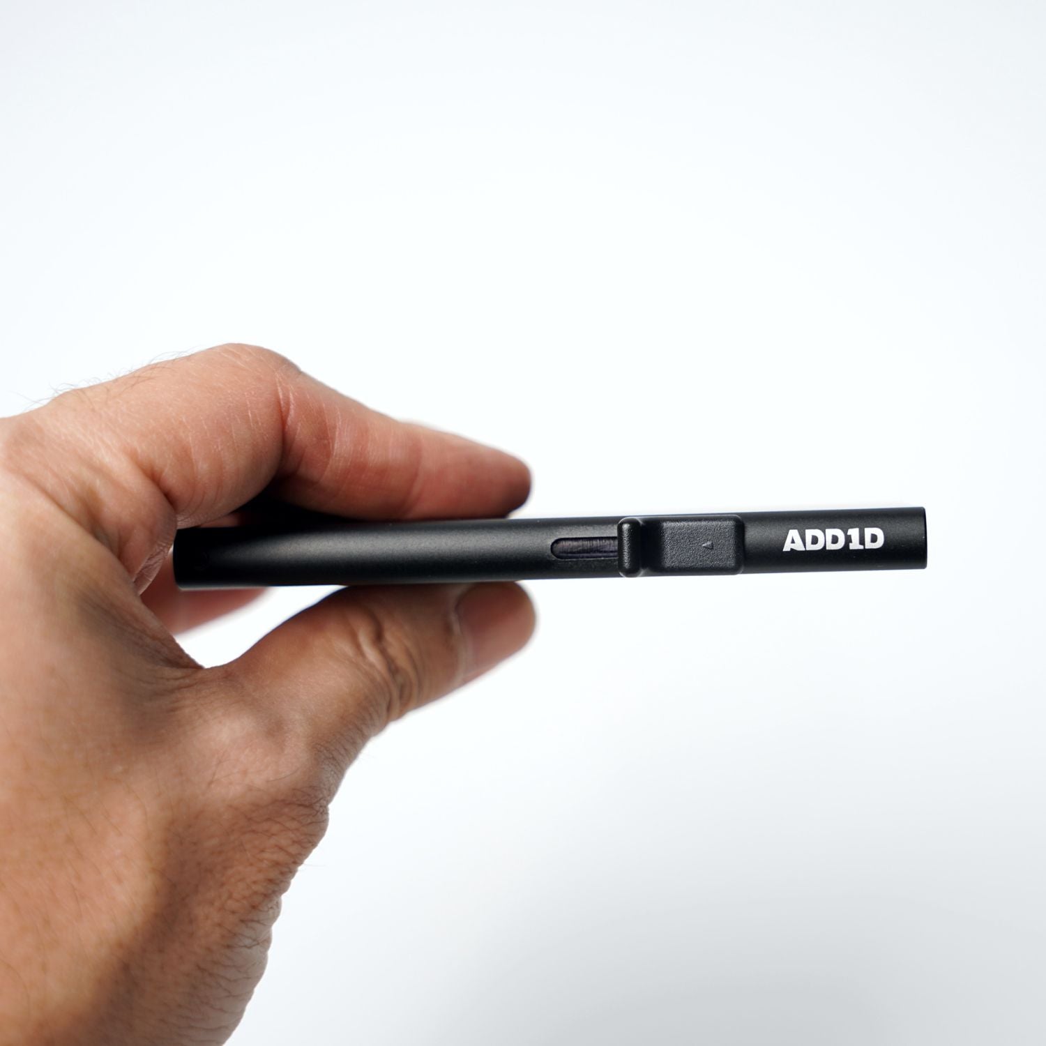 ADD1D Pop-Up Cardholder held in hand highlighting minimal front-pocket footprint