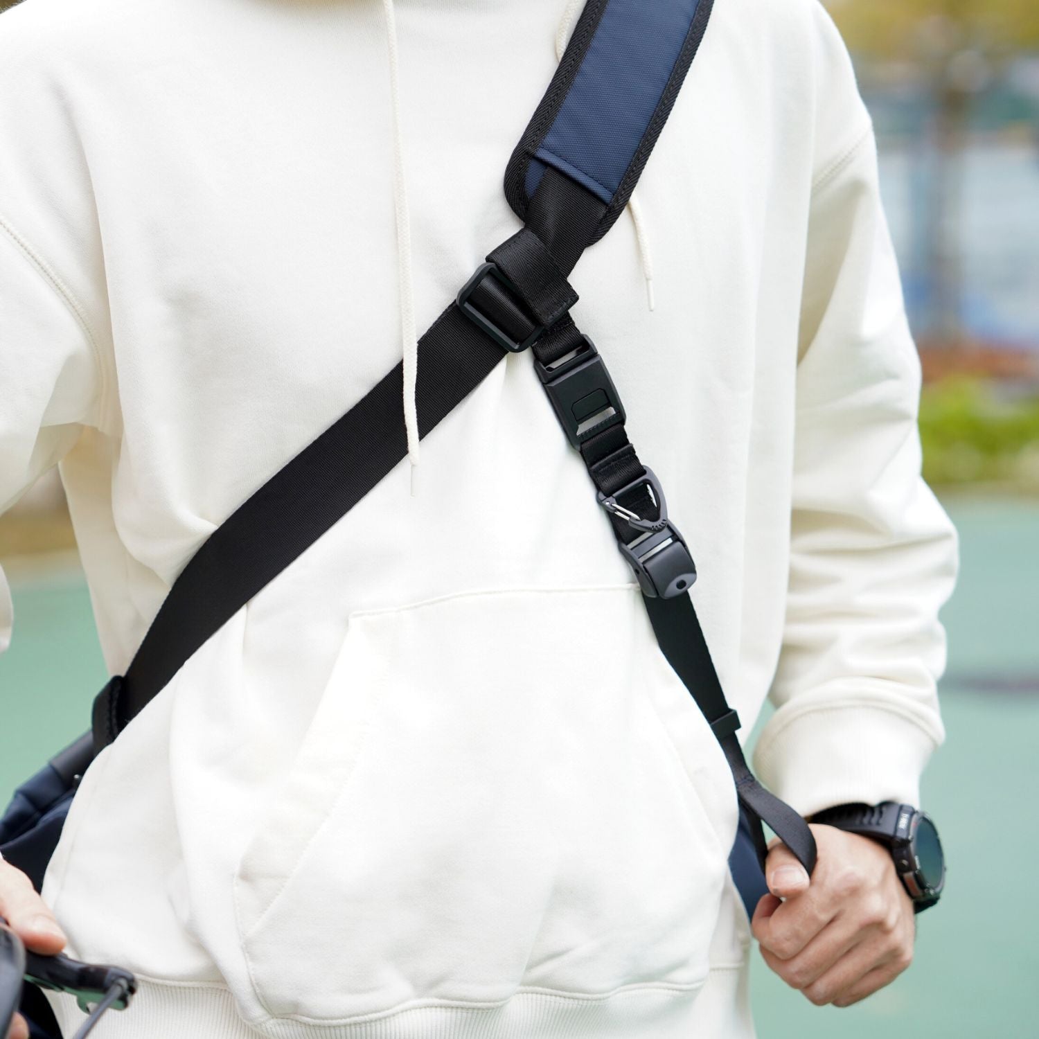 Side view of ADD1D Stabilizer Strap routed under arm for ergonomic 3-point bag stability