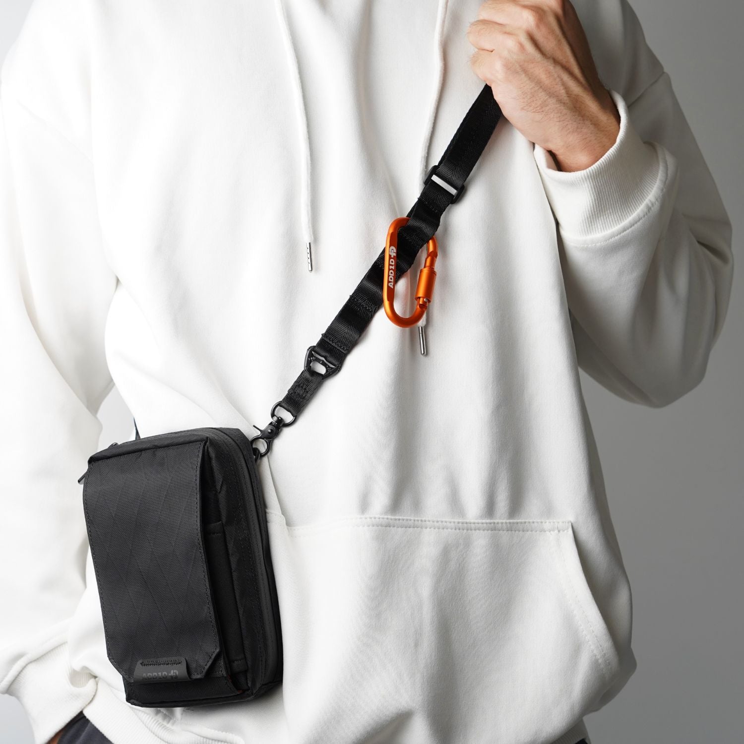 ADD1D Utility Strap attached to ADD1D D2D Pouch converting it into a crossbody sling