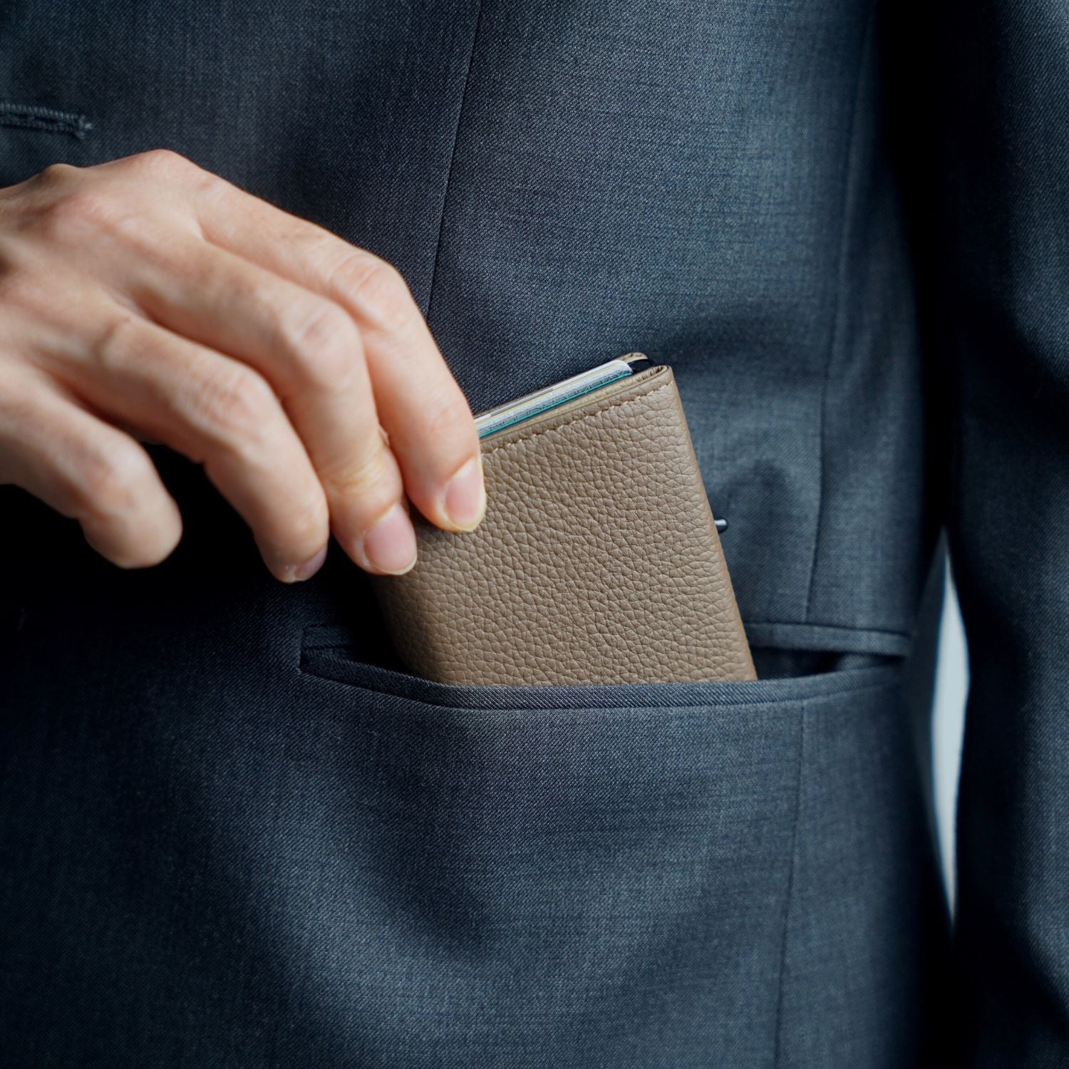 ADD1D Explorer Wallet Large Pebbled Leather Edition held as a sleek travel clutch organizer