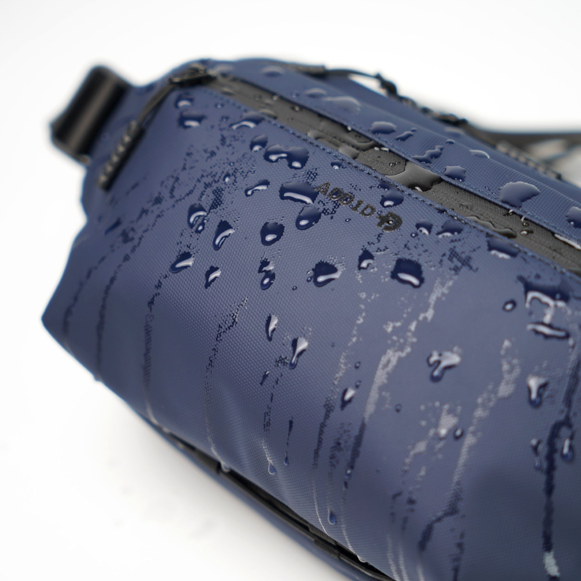 Close-up of 900D high-density waterproof fabric and YKK AquaGuard zipper on ADD1D Kangaroo Sling